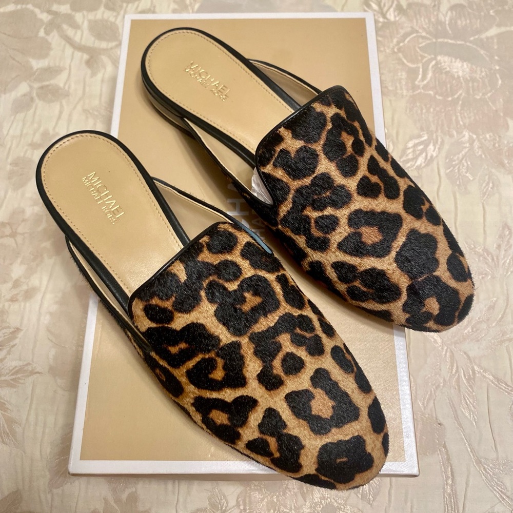 Brand New Michael Kors “Natasha Slide” in printed hair calf. Size 7.